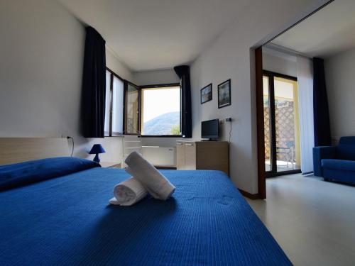Postel nebo postele na pokoji v ubytování Hotel Residence Mondial