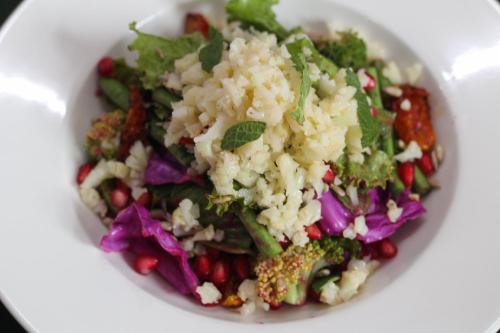 a white bowl of salad with rice and vegetables at ROKPA Guest House in Kathmandu