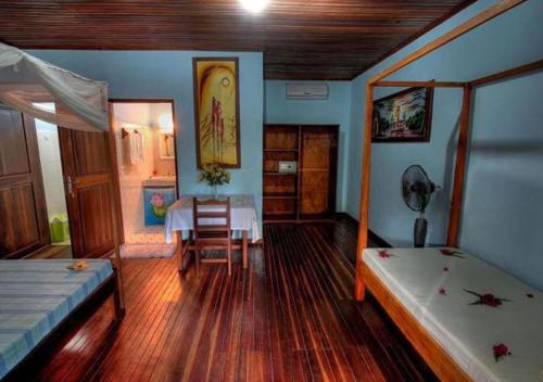 Postel nebo postele na pokoji v ubytování Tropic Hôtel