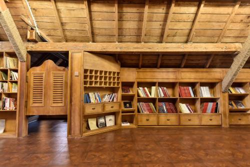 a library with wooden shelves filled with books at Nordic Memory in Qingdao in Qingdao