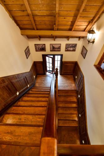 a winding staircase in a house with wooden ceilings at Nordic Memory in Qingdao in Qingdao