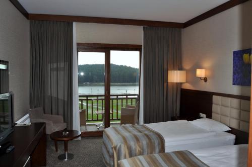 En eller flere senge i et værelse på Fenerbahçe Serkan Acar Resort&Sports Topuk Yaylası