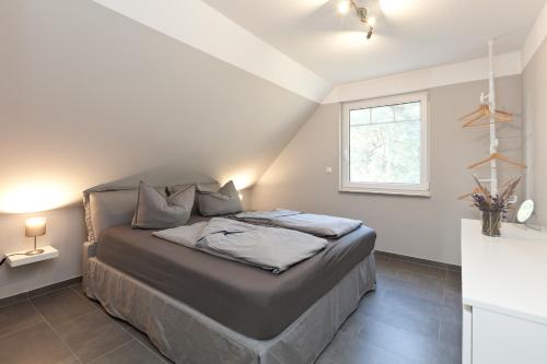 Ένα ή περισσότερα κρεβάτια σε δωμάτιο στο Apartment unter den Kiefern