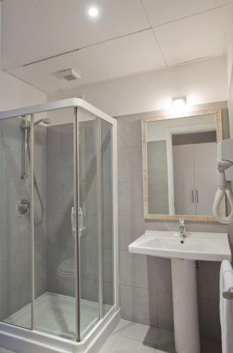a bathroom with a shower and a sink at City Guest House in Rome