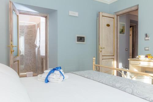 Ένα ή περισσότερα κρεβάτια σε δωμάτιο στο Le torri di Tarquinia