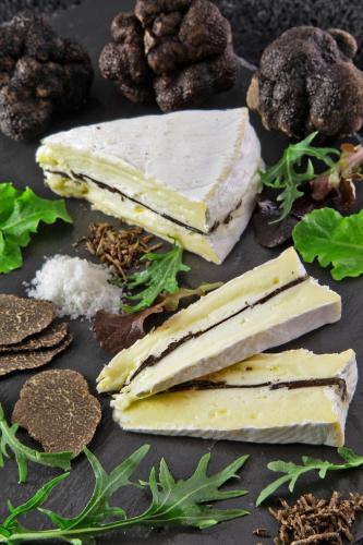a plate of food with cheese and other foods at L'Aquitaine - Cahors Sud in LʼHospitalet