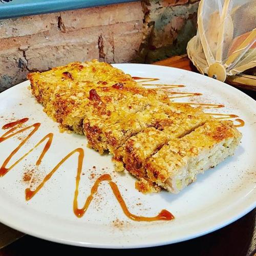 a piece of food on a white plate at Viver Bahia Pousada in Salvador