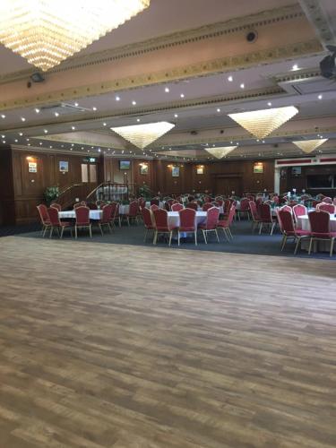 a banquet hall with tables and chairs in a room at Durrant House Hotel in Bideford