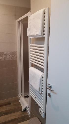 a towel rack in a bathroom with a shower at A Casa di Asia in Grosseto
