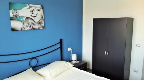 Кровать или кровати в номере Casa Vacanze residence Cavour