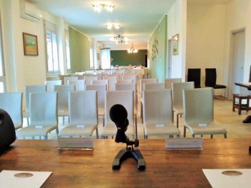 a room with a lot of chairs at Hotel San Marco in Reggio Emilia