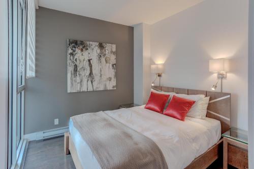 Ένα ή περισσότερα κρεβάτια σε δωμάτιο στο Les Immeubles Charlevoix - Le 760504