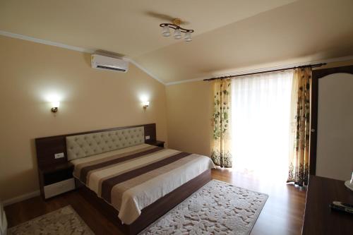 Postel nebo postele na pokoji v ubytování Casa Camelia Felix