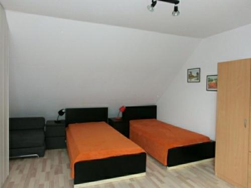 Ένα ή περισσότερα κρεβάτια σε δωμάτιο στο Ferienwohnung Kleine