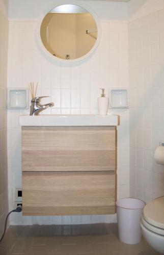 a bathroom with a sink and a mirror at Piedaterre sulle Mura - Treviso to Venice in Treviso
