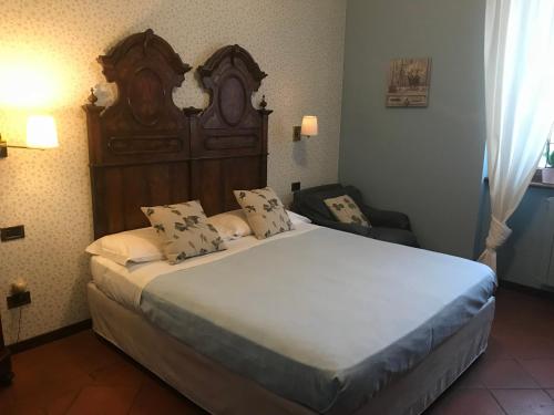 מיטה או מיטות בחדר ב-Albergo & Ristorante Selvatico