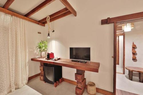 Televisyen dan/atau pusat hiburan di Camurim Grande Pousada & SPA - Jantar Incluído