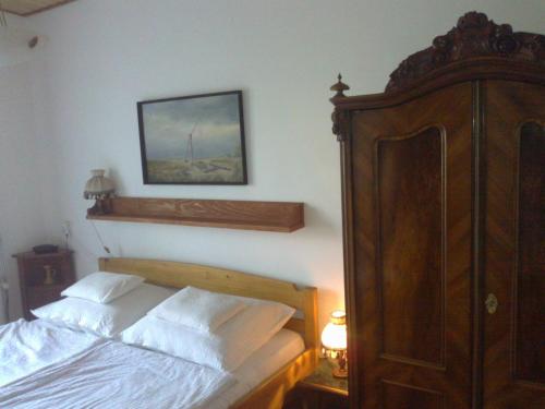 Una cama o camas en una habitación de Puszta Hotel