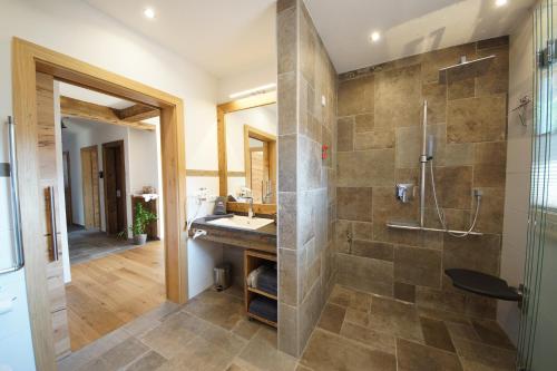 a bathroom with a shower and a sink at Kaiserappartements-Marie in Ellmau