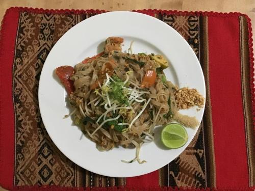 a plate of food with noodles on a table at La Casa de Zarela in Huaraz