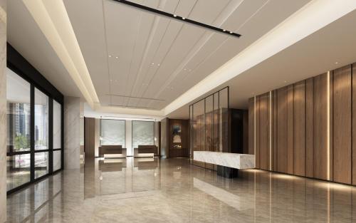 a lobby with wood paneling and a marble counter at Fairfield by Marriott Guangzhou Tianhe Park in Guangzhou