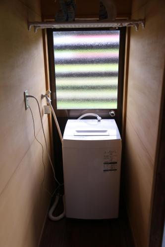 a window with a heater in the corner of a room at KOME HOME in Tokamachi
