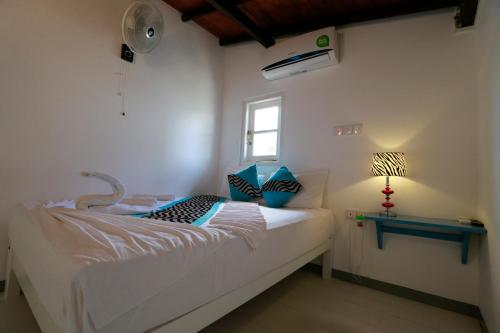 Кровать или кровати в номере Fort Heaven - Galle Fort