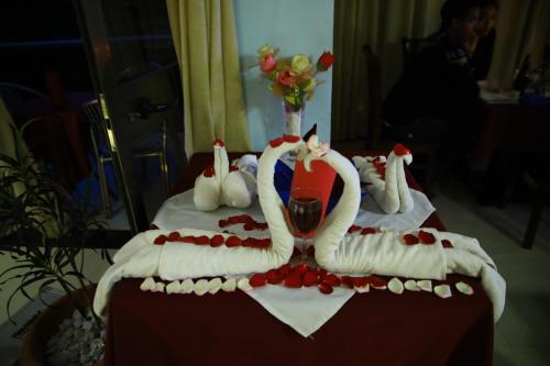 a cake with two swans on top of a table at Lakemark Hotel and Tour Service Bahir Dar in Bahir Dar