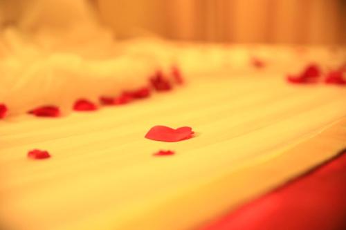 a close up of a cake with red hearts on it at Lakemark Hotel and Tour Service Bahir Dar in Bahir Dar