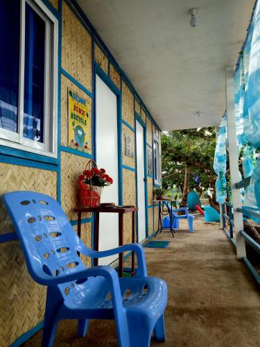 a playground with blue plastic chairs in a room at Bolo Beach Santorini nearby to Hundred Island in Alaminos