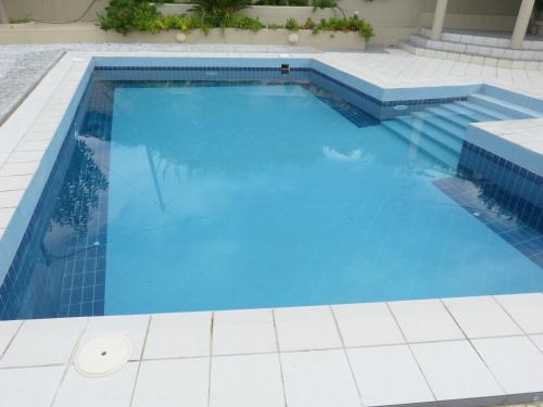a large swimming pool with blue water at Knossos Palace Secluded Villa in Skalánion