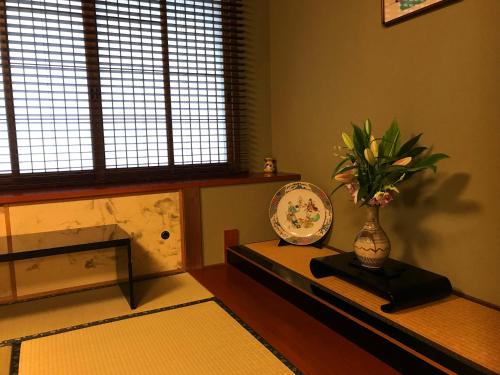 Ein Bett oder Betten in einem Zimmer der Unterkunft Beppu Kannawa Onsen Oniyama Hotel