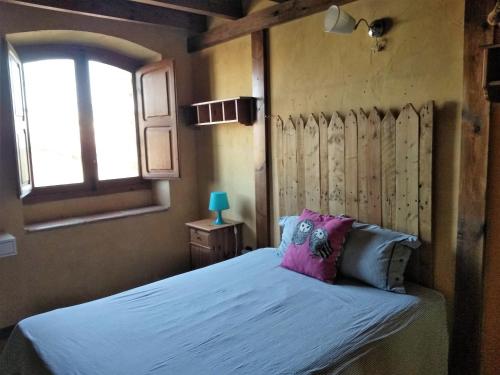 Tempat tidur dalam kamar di La Toscana