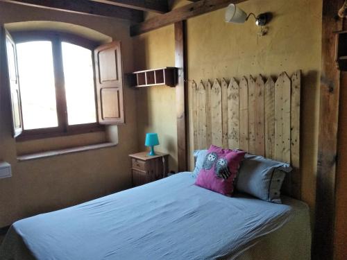 A bed or beds in a room at La Toscana