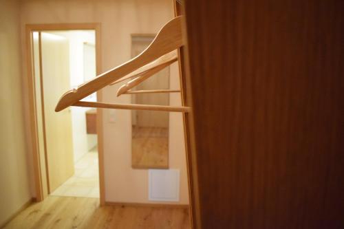 a wooden staircase in a room with a hallway at Haus Partale in Oberstdorf