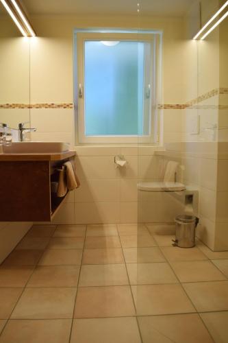 a bathroom with a sink and a window at Haus Partale in Oberstdorf