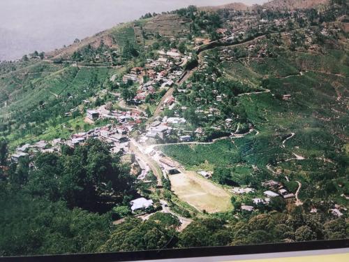 an aerial view of a village on a mountain at RIO Homestay in Haputale