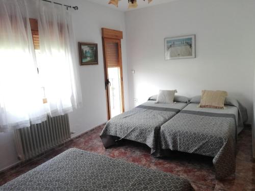 Posteľ alebo postele v izbe v ubytovaní Casa Alicia