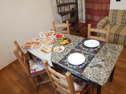 a table with plates of food on top of it at La Casetta in Gerace