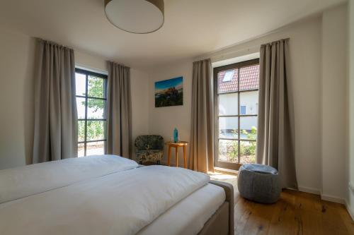 Postel nebo postele na pokoji v ubytování Pension Kleiner König