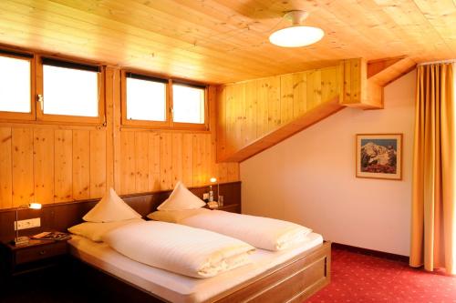 Кровать или кровати в номере Hotel Sport Robert