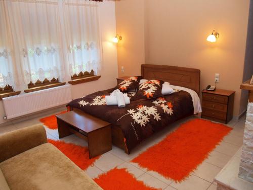 Postel nebo postele na pokoji v ubytování Hotel Ilianna