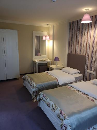 Postel nebo postele na pokoji v ubytování Parish Hotel