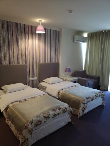 Postel nebo postele na pokoji v ubytování Parish Hotel