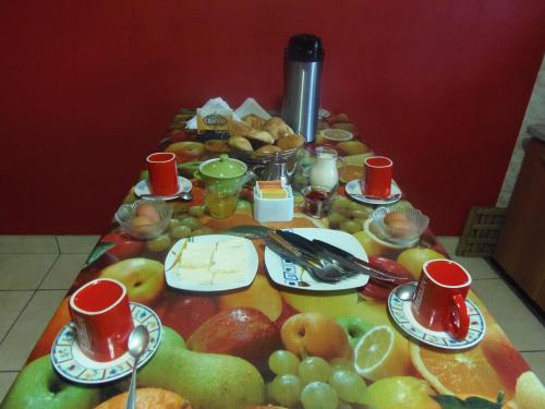 a table with a bunch of fruit on it at Ramirez House in Arequipa