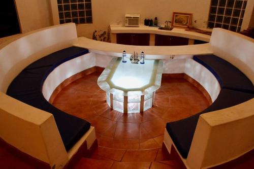 a glass table in the middle of a room at Casa San José in El Conacaste