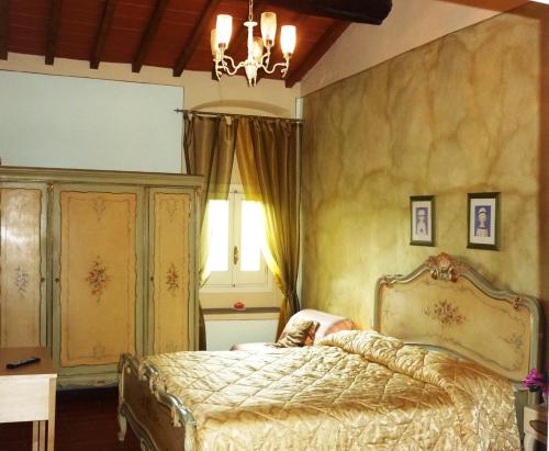 Postel nebo postele na pokoji v ubytování B&B Casale Ginette