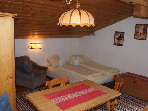 a living room with a couch and a table at Plattnerhof Kaunertal in Kaunertal