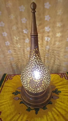 a lamp sitting on top of a table at Morocco Deluxe Camp - Assif n'Itrane in Lac Yasmins