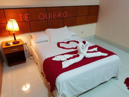 Postel nebo postele na pokoji v ubytování Hotel Murali - Cerca del Aeropuerto de Guayaquil